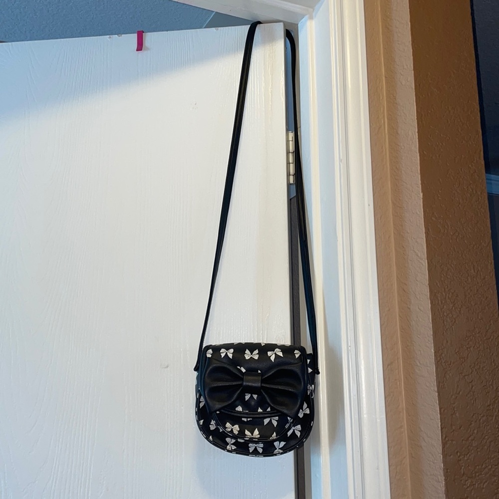 Black and white bowtie Claire’s bag